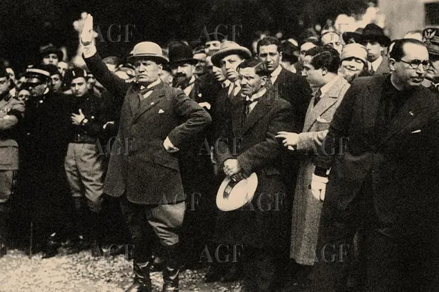 Benito Mussolini, between the members of the Fascist Party, shortly after the March on Rome, 1922. Private Collection.