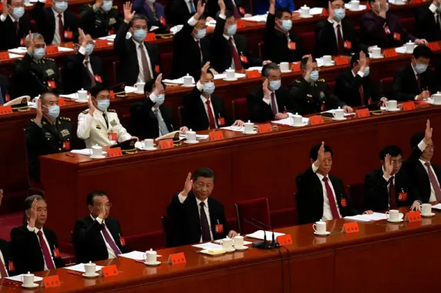 Chinese President Xi Jinping, center, attends the closing ceremony of the 20th National Congress of China's ruling Communist Party at the Great Hall of the People in Beijing, Saturday, Oct. 22, 2022. (AP Photo/Andy Wong)
