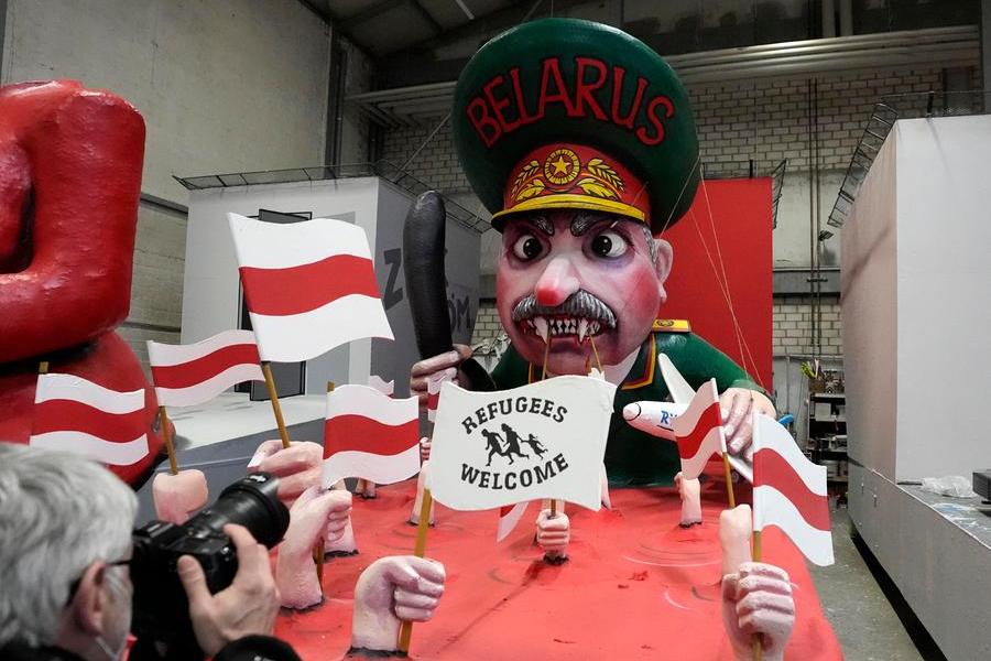 A carnival float depicts Belarus president Alexander Lukashenko at the presentation of this years satirical carnival floats for the Rose Monday Parade in Cologne, Germany, Tuesday, Feb. 22, 2022. Due to the coronavirus pandemic, this year's parade will take place in Cologne's soccer stadium with just 8000 spectators on the tribunes instead of hundreds of thousands in the streets of the carnival capital Cologne on Shrove Monday. (AP Photo/Martin Meissner)