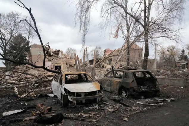 Gutted cars following a night air raid in the village of Bushiv, 40 kilometers west of Kyiv, Ukraine, Friday, March 4, 2022. Russia's war on Ukraine is now in its ninth day and Russian forces have shelled Europe's largest nuclear power plant, sparking a fire there that was extinguished overnight. (AP Photo/Efrem Lukatsky)