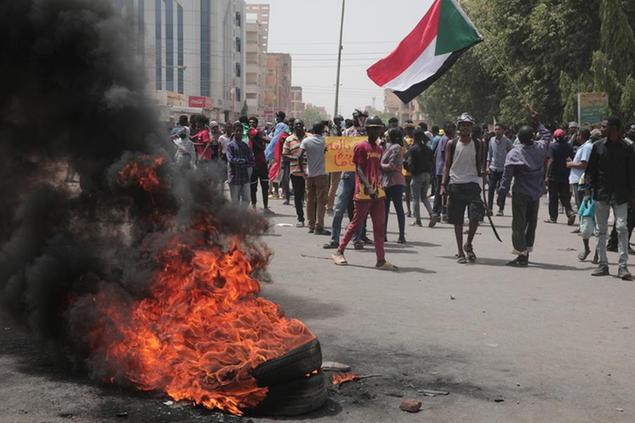 Sudanese protesters take part in a rally against military rule on the anniversary of previous popular uprisings, in Khartoum, Sudan, Thursday, May 12, 2022 . (AP Photo/Marwan Ali)