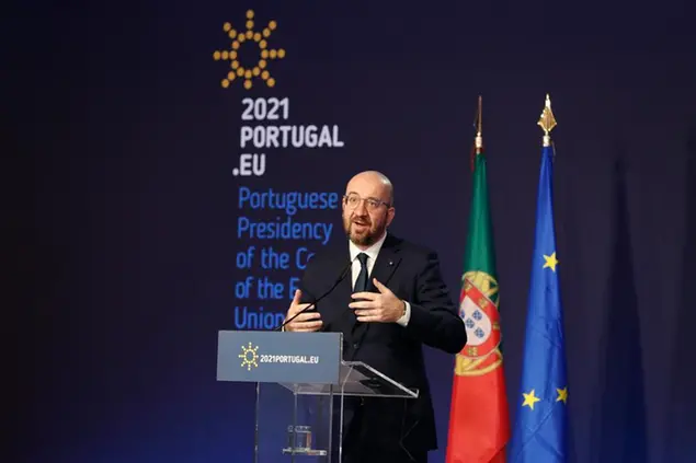 The President of the European Council Charles Michel gestures during a joint news with Portuguese Prime Minister Antonio Costa following their work meeting in Lisbon, Tuesday, Jan. 5, 2021. Michel is in Lisbon to formally mark the start of Portugal's six-month presidency of the EU. (AP Photo/Armando Franca)