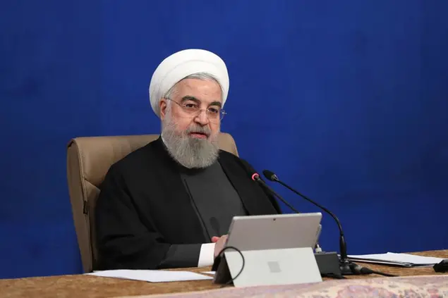 In this photo released by the official website of the office of the Iranian Presidency, President Hassan Rouhani speaks in a cabinet meeting in Tehran, Iran, Wednesday, Dec. 16, 2020. Iran's supreme leader and the country's president both warned America on Wednesday that the departure of President Donald Trump does not immediately mean better relations between the two nations. (Iranian Presidency Office via AP)