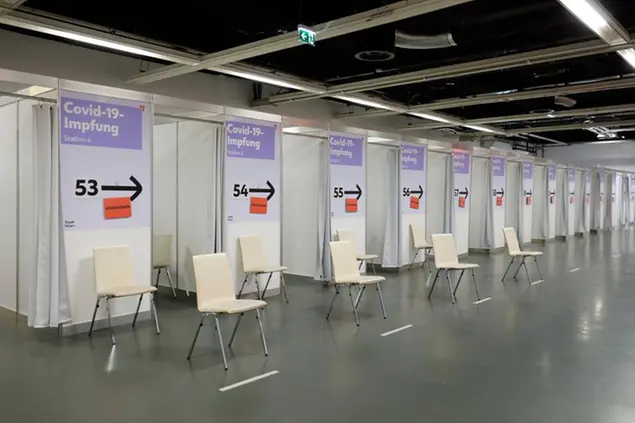 Empty vaccination cabins in the 'Austria Center Vienna' in Vienna, Austria, Friday, April 9, 2021. (AP Photo/Lisa Leutner)