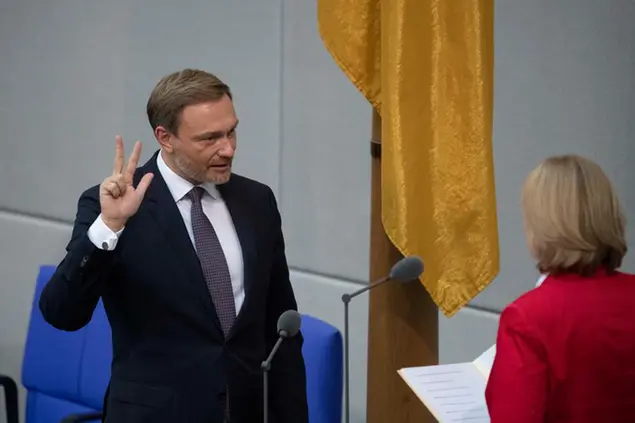 Christian LINDNER (FDP), Federal Minister of Finance, Federal Minister of Finance, takes the oath of office in front of Baerbel BAS, Barbel, President of the Bundestag, 5th plenary session of the German Bundestag with the election and swearing-in of the Chancellor and the Federal Ministers, German Bundestag in Berlin, Germany on December 8th .2021 Photo by: Malte Ossowski / SVEN SIMON/picture-alliance/dpa/AP Images