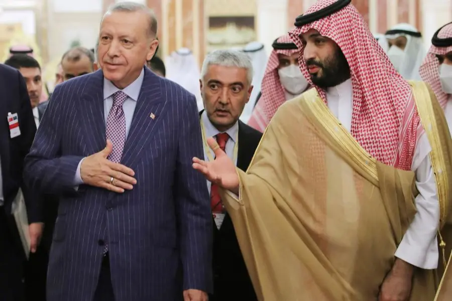 In this photo made available by the Turkish Presidency, Turkish President Recep Tayyip Erdogan, left, and Saudi Arabia's Crown Prince Mohammed bin Salman speak before a meeting in Jiddah, Saudi Arabia, Thursday, April 28, 2022. Erdogan is visiting Saudi Arabia in a major reset of relations between two regional heavyweights following the slaying of a Saudi columnist in Istanbul. The Turkish presidency said talks in Saudi Arabia will focus on ways of increasing cooperation and the sides will exchange views on regional and international issues. (Turkish Presidency via AP)