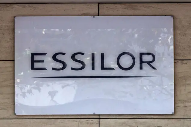 This Thursday, Sept. 22, 2016 photo shows the logo of the Essilor a French ophthalmic optics company, in Charenton le Pont, east of Paris. Essilor International SA announced Monday Jan.16, 2017 it had reached a share exchange deal with Luxottica's main shareholder Delfin to create a combined company making both frames and lenses. (AP Photo/Michel Euler)