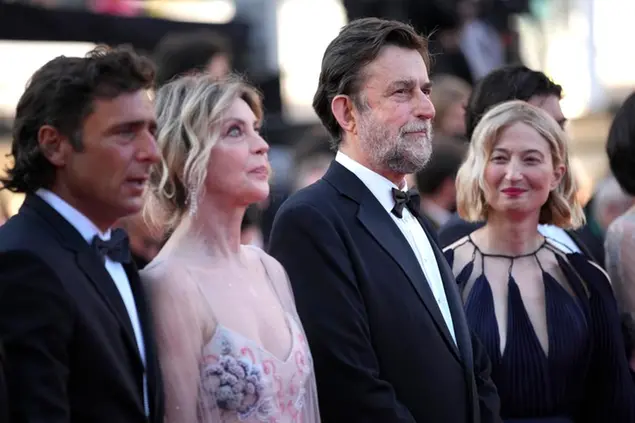 Adriano Giannini, from left, Margherita Buy, Nanni Moretti, and Alba Rohrwacher pose for photographers upon arrival at the premiere of the film 'Three Floors' at the 74th international film festival, Cannes, southern France, Sunday, July 11, 2021. (AP Photo/Vadim Ghirda)