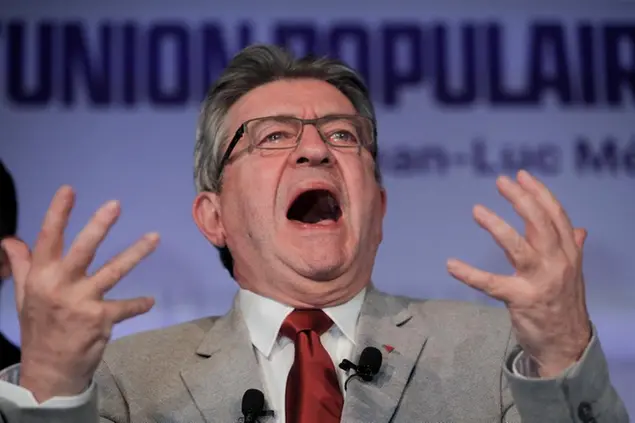 French far-left candidate Jean-Luc Melenchon comments on preliminary results of the first round of the presidential election in Paris, France, Sunday, April 10, 2022. Up to 48 million French voters headed to polling stations nationwide Sunday for the first round of the country's presidential election, one that seemed for months like a shoo-in for French President Emmanuel Macron but is now a tossup amid a strong challenge from the far right's Marine Le Pen. (AP Photo/Michel Spingler)