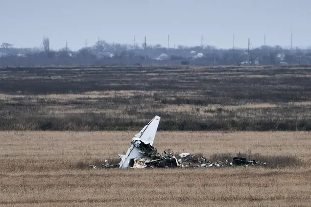 Fragments of a military plane are seen near Kherson, Ukraine, Saturday, Jan. 7, 2023. (AP Photo/Libkos)