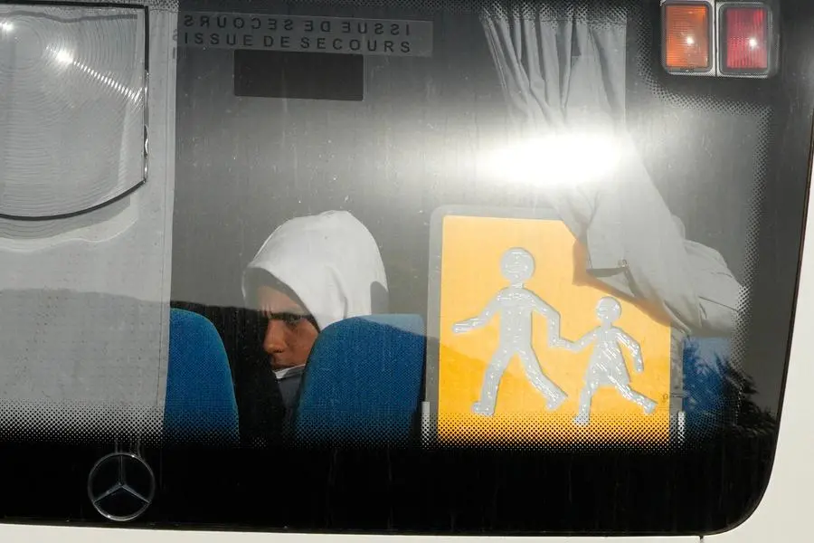 A migrant sits in a coach as he arrives at the holiday camping center in Hyeres, France, Friday, Nov. 11, 2022. The migrants had been onboard the Norwegian-flagged vessel the Ocean Viking, operated by the NGO SOS Mditerrane, and had been at sea for nearly three weeks carrying around 230 migrants. Italy had refused to allow the migrants to disembark on Italian territory. (AP Photo/Daniel Cole) Associated Press/LaPresse Only Italy and Spain