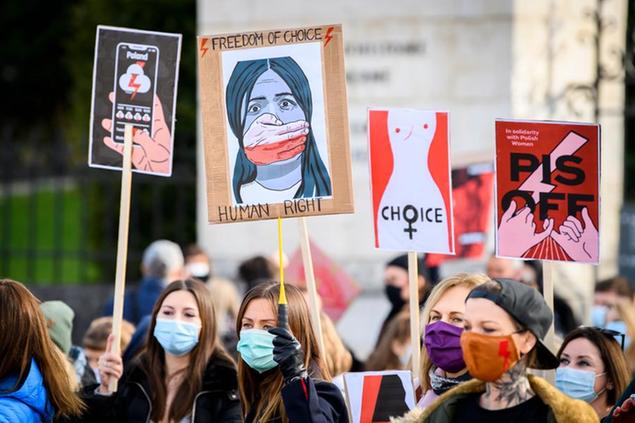 People protest in solidarity with Polish women after a top court ruled to further tighten the strict Polish abortion law, in Bern, Switzerland, on Saturday, November 7, 2020. (Anthony Anex/Keystone via AP)