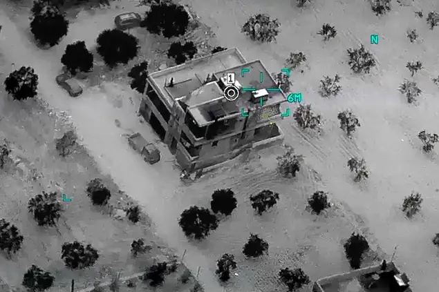 This image from video provided by the Department of Defense and released on Feb. 3, 2022, shows the compound before a raid where Abu Ibrahim al-Hashimi al-Qurayshi, leader of the Islamic State Group, died in Syria's northwestern Idlib province. A U.S. official says that the militant leader, one of the world's most wanted terrorists, exploded a bomb that killed himself and members of his family during the overnight raid by an elite U.S. military force. (Department of Defense via AP)