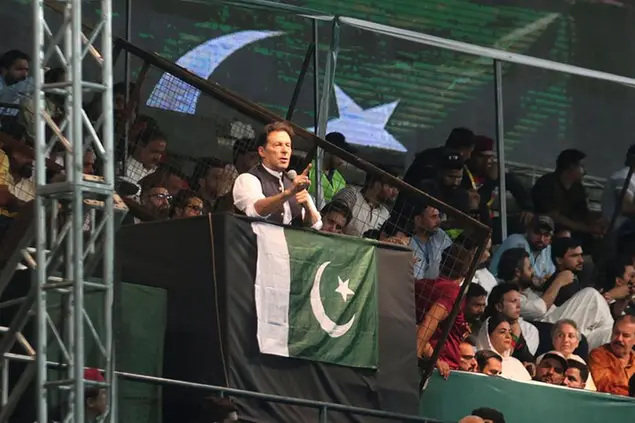 Pakistani opposition leader Imran Khan, center, addresses his party supporters during a rally to press government for fresh elections, in Lahore, Pakistan, Saturday, Aug. 13, 2022. (AP Photo/K.M. Chaudary)