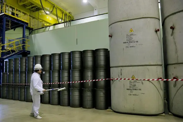 FILE - In this March 23, 2016, photo, a worker checks the radiation level on barrels in a storage of nuclear waste taken from the 4th unit destroyed by explosion at the Chernobyl nuclear power plant, Chernobyl, Ukraine. Among the most worrying developments on an already shocking day, as Russia invaded Ukraine on Thursday, was warfare at the Chernobyl nuclear plant, where radioactivity is still leaking from history's worst nuclear disaster 36 years ago.(AP Photo/Efrem Lukatsky, File)