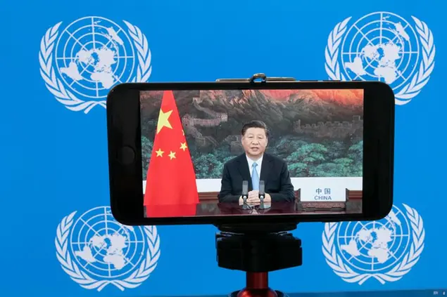 Chinese President Xi Jinping is seen on a video screen remotely addressing the 75th session of the United Nations General Assembly, Tuesday, Sept. 22, 2020, at U.N. headquarters. This year's annual gathering of world leaders at U.N. headquarters will be almost entirely \\\"virtual.\\\" Leaders have been asked to pre-record their speeches, which will be shown in the General Assembly chamber, where each of the 193 U.N. member nations are allowed to have one diplomat present. (AP Photo/Mary Altaffer)