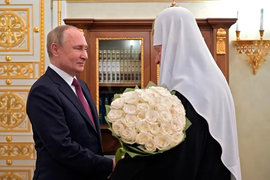 FILE - Russian President Vladimir Putin congratulates Russian Orthodox Church Patriarch Kirill on the 13th anniversary of his enthronement in Moscow, Russia, Tuesday, Feb. 1, 2022. (Alexei Nikolsky, Sputnik, Kremlin Pool Photo via AP)