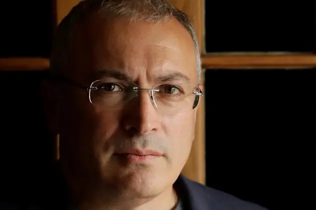FILE - In this Tuesday, July 24, 2018 file photo, Russian opposition figure Mikhail Khodorkovsky, the former owner of the Yukos Oil Company, poses for a photograph after being interviewed by The Associated Press in London. A key legal advisor to the Dutch Supreme Court on Friday April 23, 2021, recommended dismissing Russia's appeal against a lower court's decision to reinstate a $50 billion compensation award to former shareholders of the Yukos oil company. (AP Photo/Matt Dunham, File)