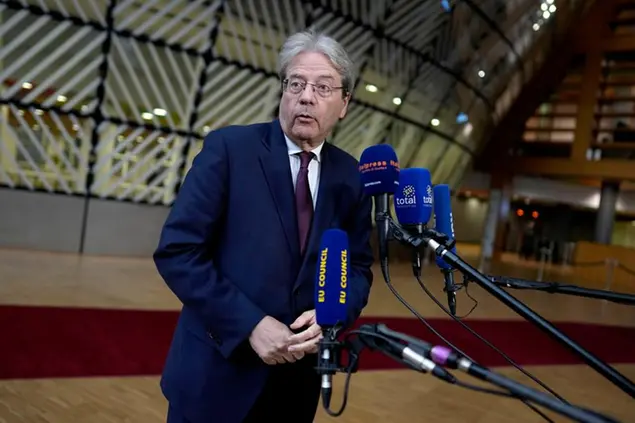 European Commissioner for Economy Paolo Gentiloni speaks with the media as he arrives for a meeting of eurogroup finance ministers at the European Council building in Brussels on Monday, Jan. 16, 2023. (AP Photo/Virginia Mayo)