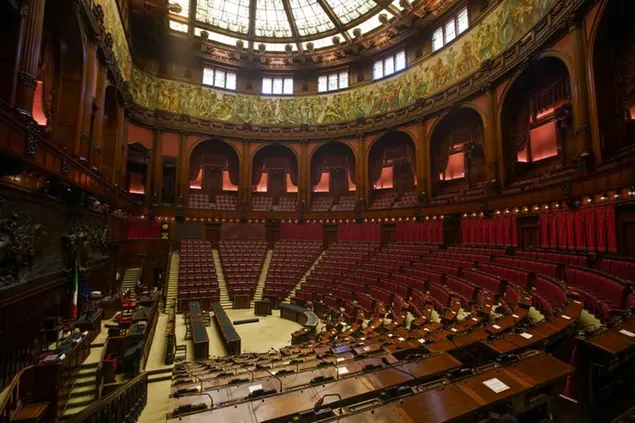 A view of the hemicycle inside Italy\\\\'s Lower Chamber Montecitorio Palace, in Rome, Wednesday, Sept. 16, 2020. Italians will vote in a national referendum next Sept. 20 and 21 to say if they want to reduce from 630 to 400 in the Chamber of Deputies and from 315 to 200 in the Senate the number of representatives. (AP Photo/Andrew Medichini)
