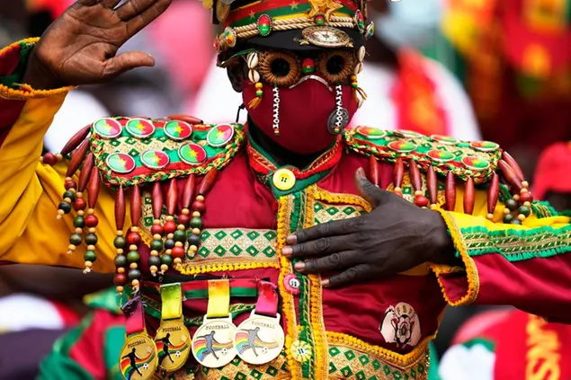 A Burkina Faso soccer fan gestures, ahead of the African Cup of Nations 2022 group A soccer match between Cape Verde and Burkina Faso at the Ahmadou Ahidjo stadium in Yaounde, Cameroon, Thursday, Jan. 13, 2022. (AP Photo/Themba Hadebe)