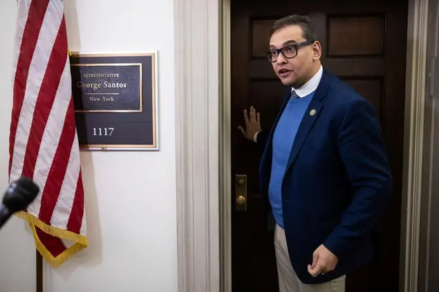 Rep. George Santos (R-N.Y.) speaks with journalists outside his office on Capitol Hill Jan. 26, 2023. (Francis Chung/POLITICO via AP Images)