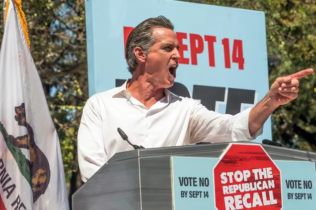 California Democratic Gov. Gavin Newsom campaigns against the California recall election at Culver City High School in Culver City, Calif., Saturday, Sept. 4, 2021. Newsom warned that Trump was defeated in 2020 but \\\"we did not defeat Trumpism.\\\" With just nine days remaining in the contest, \\\"Racial justice is on the ballot. Economic justice in on the ballot. Social justice in on the ballot. Environmental justice is on the ballot,\\\" the governor said to hundreds of sign-waving supporters, who responded by chanting \\\"Vote no\\\" on the recall. (AP Photo/Damian Dovarganes)