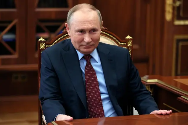 Russian President Vladimir Putin listens to the head of the Russian Union of Industrialists and Entrepreneurs Alexander Shokhin during their meeting in Moscow, Russia, Wednesday, March 2, 2022. (Mikhail Klimentyev, Sputnik, Kremlin Pool Photo via AP)