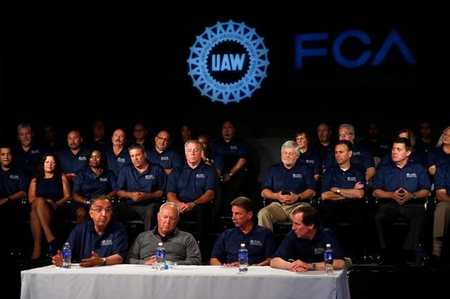 Fiat Chrysler Automobiles CEO Sergio Marchionne, seated from left, United Auto Workers President Dennis Williams, Norwood Jewell, Vice President of the Fiat Chrysler Automobiles US Department, UAW and Glenn Shagena, FCA North American Vice President, Employee Relations address the media during a ceremony to mark the opening of contract negotiations Tuesday, July 14, 2015 in Detroit. (AP Photo/Paul Sancya)