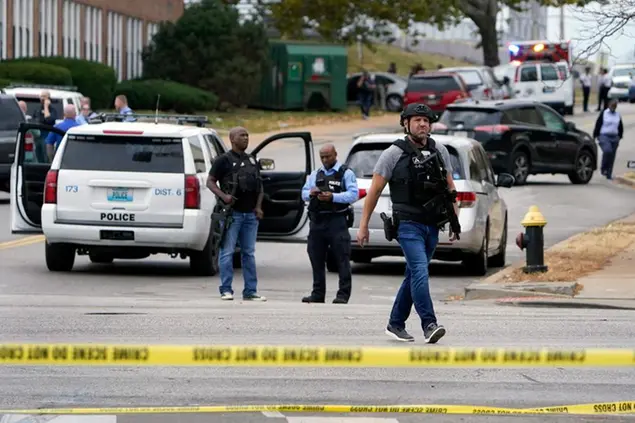 Law enforcement investigate the scene of a shooting at Central Visual and Performing Arts High School Monday, Oct. 24, 2022, in St. Louis. (AP Photo/Jeff Roberson)