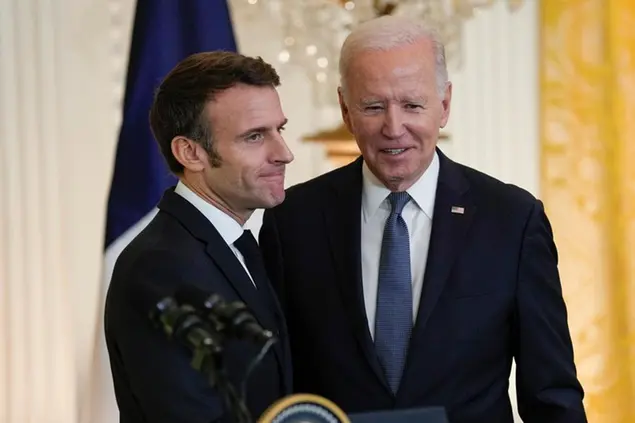 President Joe Biden stands with French President Emmanuel Macron after a news conference in the East Room of the White House in Washington, Thursday, Dec. 1, 2022. (AP Photo/Susan Walsh)
