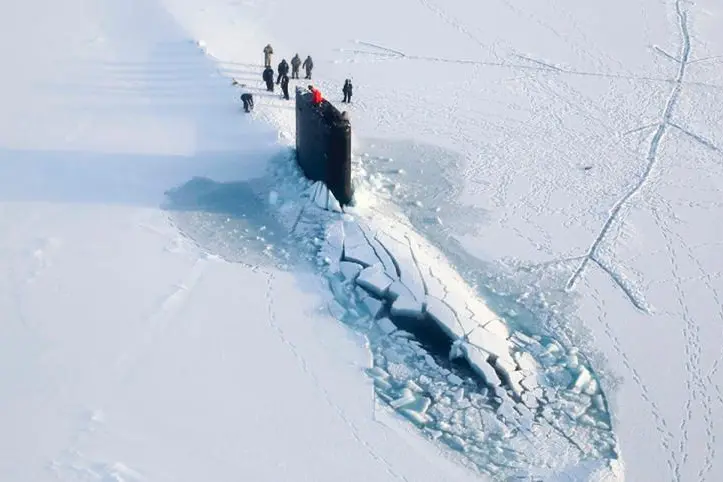 This 2016 photo provided by the U.S. Navy, shows a submarine after breaking through ice in the Beaufort Sea off Alaska's north coast. The U.S. Navy has kicked off biennial submarine testing and training under sea ice off Alaska's north coast--the exercises are dubbed Ice Exercise 2018, or ICEX18, and will include maneuvers by three submarines under Arctic ice, including a British vessel, over five weeks. (U.S. Navy via AP)