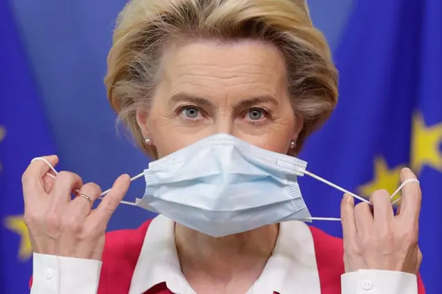 European Commission President Ursula von der Leyen removes her face mask before giving a statement at the European Commission headquarters in Brussels, Wednesday, Sept. 23, 2020. (Stephanie Lecocq/Pool Photo via AP)