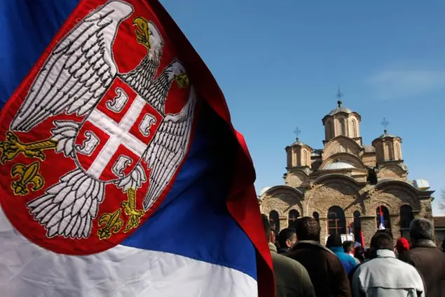 The Serbian flag is seen while ethnic Serbs protest against Kosovo's declaration of independence near the orthodox monastery in the Serbian enclave of Gracanica, Kosovo, Monday, Feb. 18, 2008. Kosovo's leaders sent letters to 192 countries Monday seeking formal recognition of independence, and suspense gripped the capital as its citizens awaited backing from the U.S. and key European powers. (AP Photo/Visar Kryeziu)