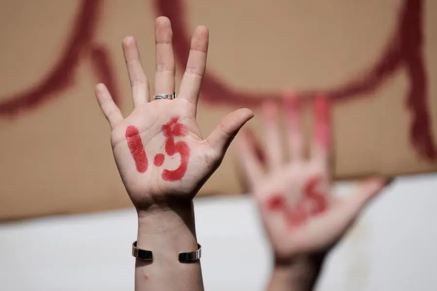 Demonstrators have 1.5 written on their hands as they advocate for the 1.5 degree warming goal at the COP27 U.N. Climate Summit, Wednesday, Nov. 16, 2022, in Sharm el-Sheikh, Egypt. (AP Photo/Nariman El-Mofty) Associated Press/LaPresse Only Italy and Spain