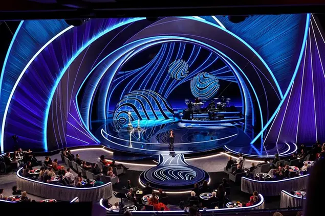 Host Wanda Sykes appears on stage at the Oscars on Sunday, March 27, 2022, at the Dolby Theatre in Los Angeles. (AP Photo/Chris Pizzello)