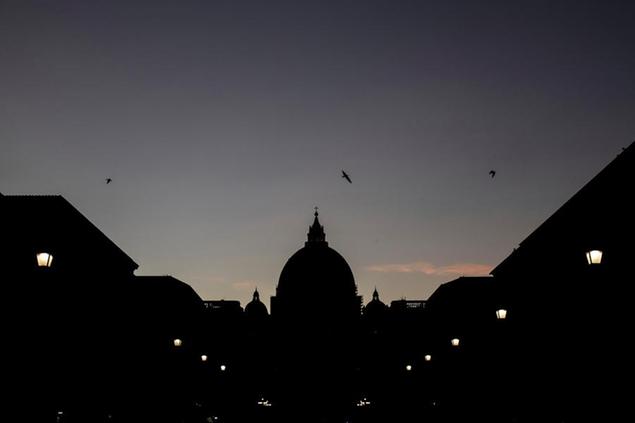 09 February 2022, Italy, Rom: The dome of St. Peter's Basilica silhouetted against the evening sky. View of St. Peter's Basilica from Via della Conciliazione. Photo by: Oliver Weiken/picture-alliance/dpa/AP Images