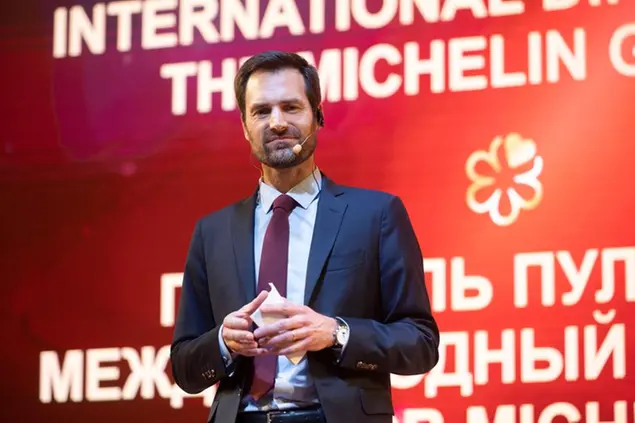 Gwendal Poullennec, international director of the Michelin Guides speaks to the media prior to the award ceremony, which took place in the concert hall of Zaryadye Park in Moscow, Russia, Thursday, Oct. 14, 2021. French gastronomic bible the Michelin Guide awarded nine of its coveted stars to restaurants in Moscow on Thursday as it unveiled its first lineup of recommendations in the Russian capital. Representatives of the guide — considered the international standard of restaurant rankings — released the first Moscow edition of their iconic red book at a ceremony at Moscow. (AP Photo/Dmitry Serebryakov)