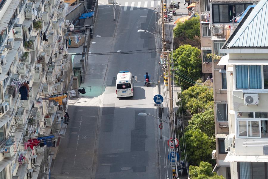 An ambulance runs in an empty street in Shanghai, China Friday, April 08, 2022. (FeatureChina via AP Images)