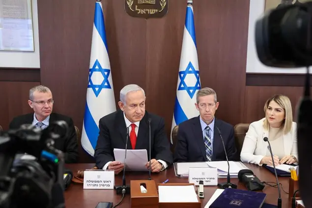 Israeli Prime Minister Benjamin Netanyahu, second left, chairs the weekly cabinet meeting at the Prime Minister's office in Jerusalem, Sunday March 5, 2023. (Gil Cohen-Magen/Pool via AP)