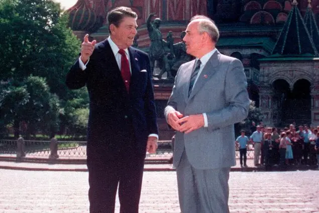 FILE - U.S. President Ronald Reagan, left, and Soviet leader Mikhail Gorbachev talk during their walk in Red Square, with St. Basil's Cathedral in the background, in Moscow, Soviet Union, Tuesday, May 31, 1988. Russian news agencies are reporting that former Soviet President Mikhail Gorbachev has died at 91. The Tass, RIA Novosti and Interfax news agencies cited the Central Clinical Hospital. (AP Photo/Ira Schwartz, File)