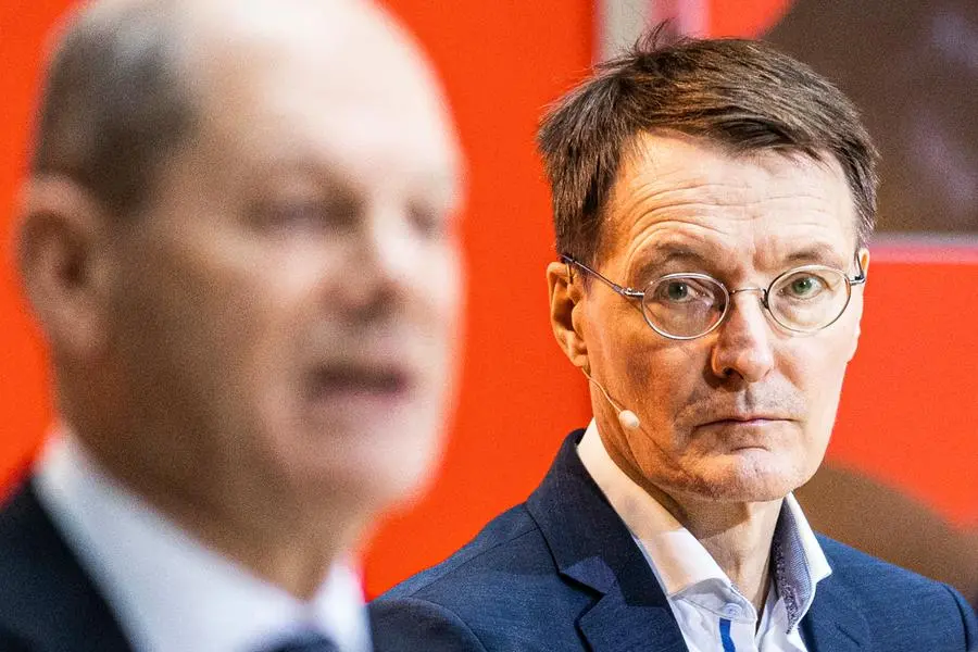 (LR) Olaf Scholz, designated Federal Chancellor, and Karl Lauterbach, designated Federal Minister of Health, recorded as part of the nomination of the future Federal Ministers of the SPD in the Willy Brandt House in Berlin, December 6th, 2021. The SPD voted at a digital party congress with 98.8 percent for the coalition agreement with Buendnis 90 / Die Gruenen and the FDP. On Wednesday, December 8th, Olaf Scholz is to be elected and sworn in as Federal Chancellor. Copyright: Florian Gaertner / photothek.de Photo by: Florian Gaertner/picture-alliance/dpa/AP Images