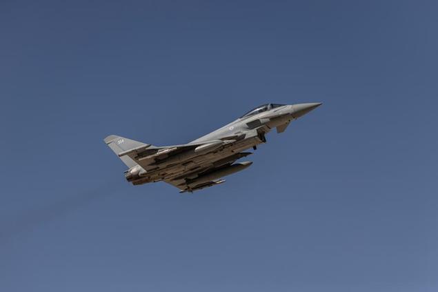 A British Eurofighter Typhoon fly over Ovda airbase during the bi-annual multi-national aerial exercise known as the Blue Flag, near Eilat, southern Israel, Sunday, Oct. 24, 2021. Israel's military is holding the largest ever air drill of its kind with participation from eight countries including the U.S., Britain, Germany, Italy, Greece, India and France in the two week-long drill. (AP Photo/Tsafrir Abayov)