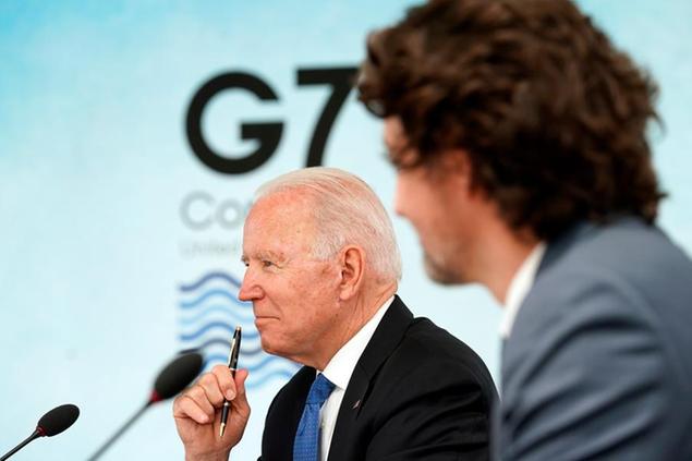 President Joe Biden and Canadian Prime Minister Justin Trudeau attend the G-7 summit at the Carbis Bay Hotel in Carbis Bay, St. Ives, Cornwall, England, Friday, June 11, 2021. Leaders of the G-7 begin their first of three days of meetings on Friday, in which they will discuss COVID-19, climate, foreign policy and the economy. (Kevin Lamarque/Pool via AP)