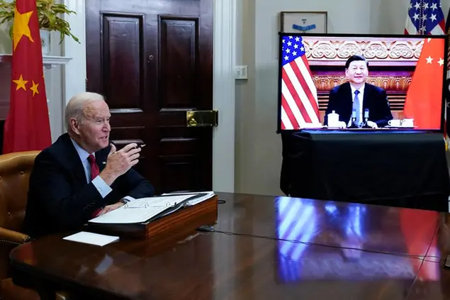 FILE - President Joe Biden meets virtually with Chinese President Xi Jinping from the Roosevelt Room of the White House in Washington, on Nov. 15, 2021. (AP Photo/Susan Walsh, File)