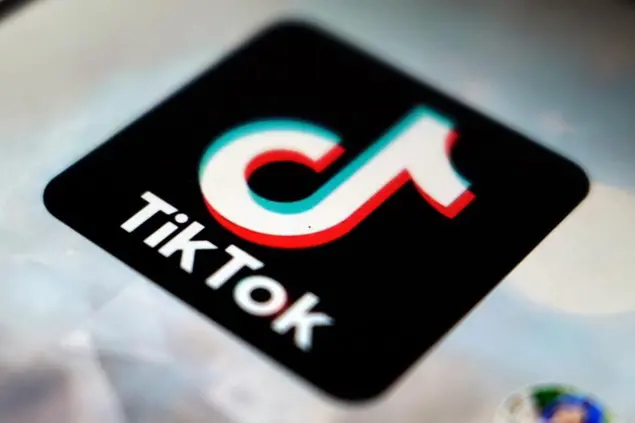 FILE - In this Sept. 28, 2020 file photo, a view of the TikTok app logo, in Tokyo. Social media and other internet companies face big fines in Britain if they don't limit the amount of harmful material such as child sexual abuse or terrorist content on their platforms, officials said Tuesday, Dec. 15, 2020. (AP Photo/Kiichiro Sato, File)