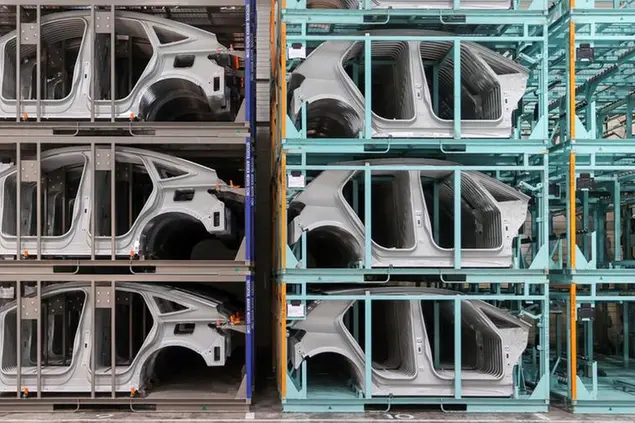 05 May 2021, Saxony, Zwickau: Side parts for VW electric vehicles stand in a warehouse at the plant. Volkswagen commissioned the expansion of its pressing plant on the same day. Almost all body parts of the models built in Zwickau can now be pressed on site and many transports can be saved. VW speaks of more than 9000 truck journeys that are eliminated annually. In addition, the expansion has created 60 new jobs. In addition, 74 million euros were invested. The plant in Zwickau with about 8500 employees is the most important factory for electric cars of Volkswagen in Germany. Photo by: Jan Woitas/picture-alliance/dpa/AP Images