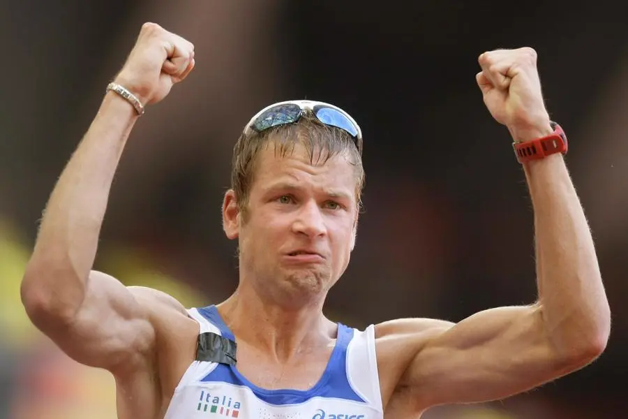 FILE -- In this Aug. 22, 2008 file photo, Italy's Alex Schwazer celebrates as he wins the men's 50-kilometer walk during the athletics competitions in the National Stadium at the Beijing 2008 Olympics in Beijing. Alex Schwazer made a triumphant return from a doping ban to win the 50-kilometer event at the world race walking team championships on Sunday. (AP Photo/Anja Niedringhaus)
