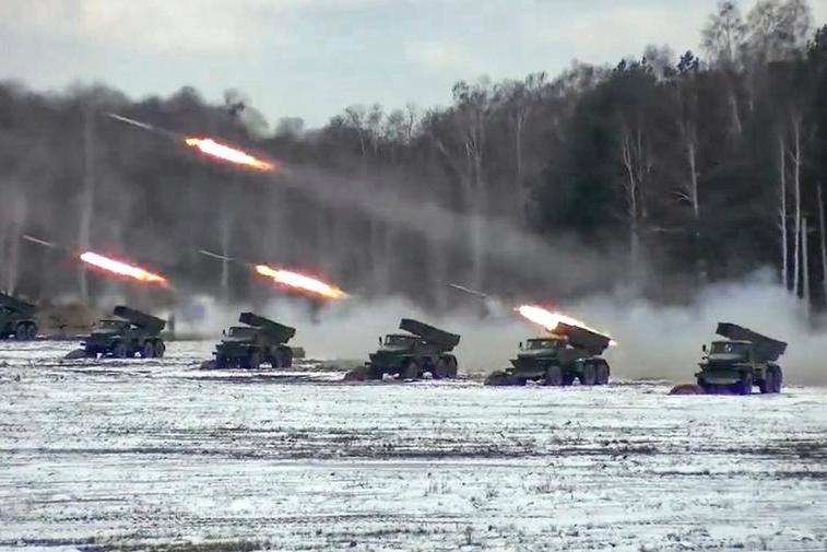 FILE - In this photo taken from video and released by the Russian Defense Ministry Press Service on Friday, Feb. 4, 2022, multiple rocket launchers fire during the Belarusian and Russian joint military drills at Brestsky firing range, Belarus. The Russian invasion of Ukraine is the largest conflict that Europe has seen since World War II, with Russia conducting a multi-pronged offensive across the country. The Russian military has pummeled wide areas in Ukraine with air strikes and has conducted massive rocket and artillery bombardment resulting in massive casualties. (Russian Defense Ministry Press Service via AP, File)