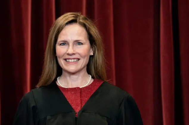 Associate Justice Amy Coney Barrett stands during a group photo at the Supreme Court in Washington, Friday, April 23, 2021. (Erin Schaff/The New York Times via AP, Pool)